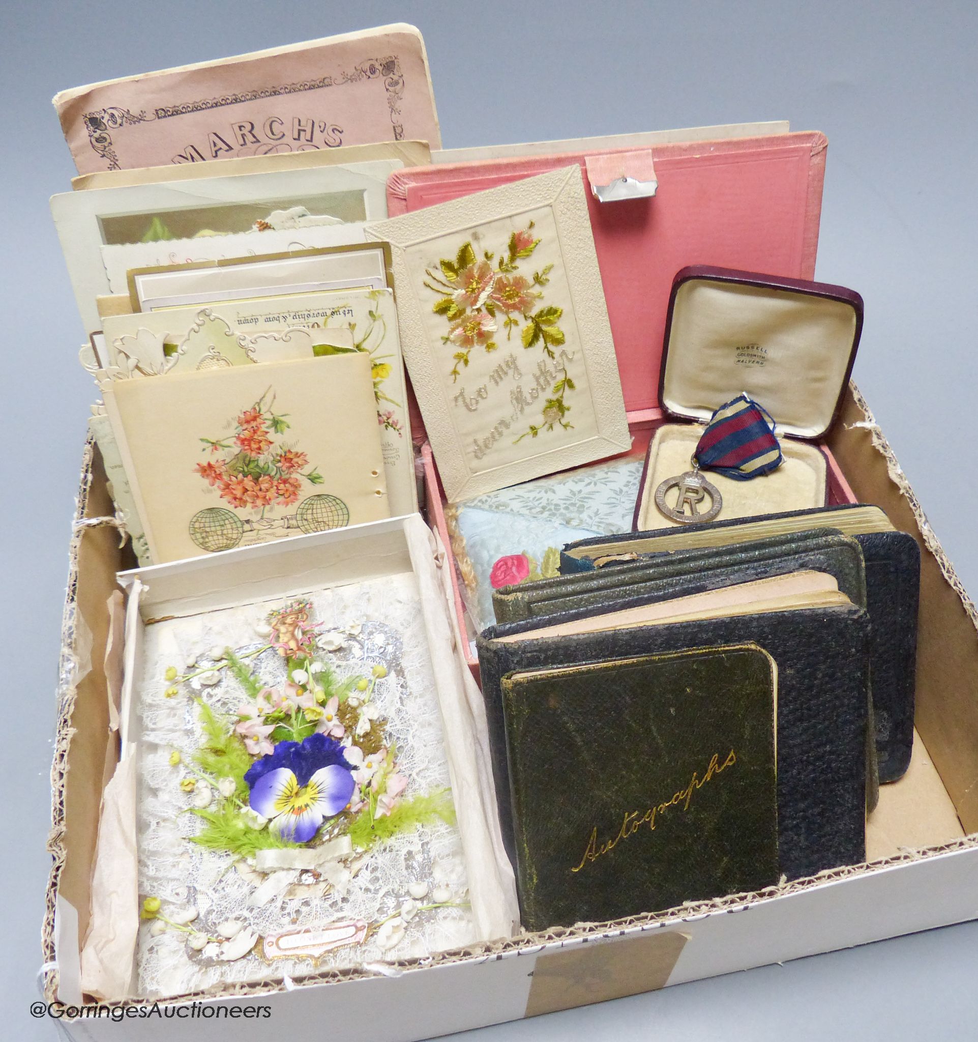 A collection of early 20th century greetings cards, Valentine's cards, autograph albums etc